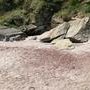 Plage des sables rouges